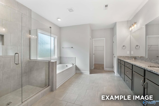 bathroom featuring tile patterned floors, vanity, and shower with separate bathtub