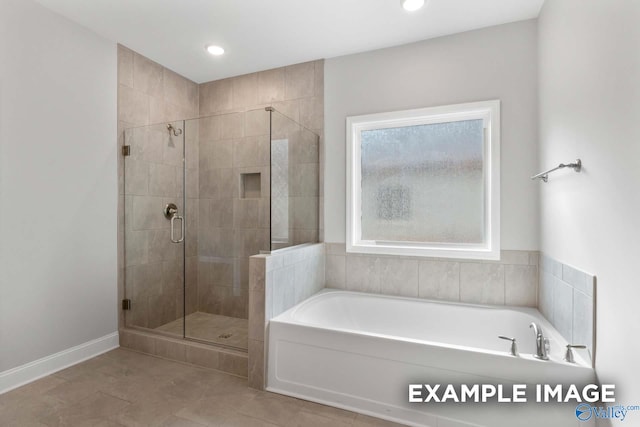 bathroom with independent shower and bath