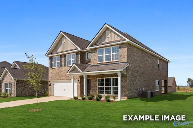 craftsman-style home with a front lawn, a garage, and cooling unit