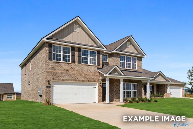 craftsman house featuring a front yard and a garage