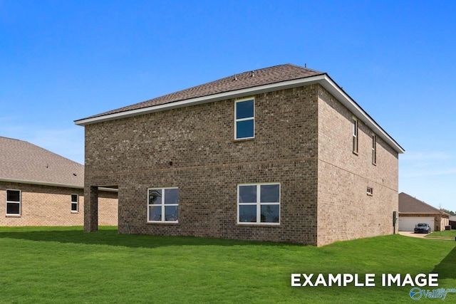 rear view of house featuring a lawn