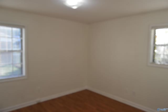 empty room with wood-type flooring