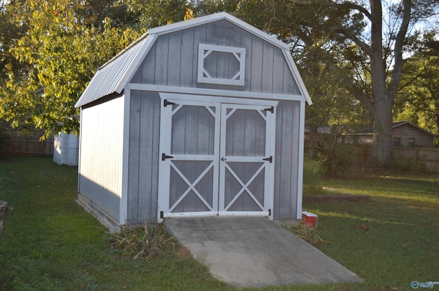 view of outdoor structure featuring a lawn