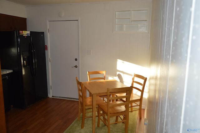 dining area featuring dark hardwood / wood-style flooring