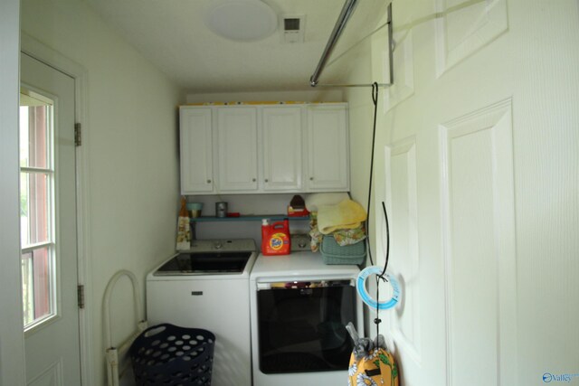 207 Brook Wind Dr, Hazel Green, AL 35750 - laundry room with washer and dryer, cabinet space, and visible vents