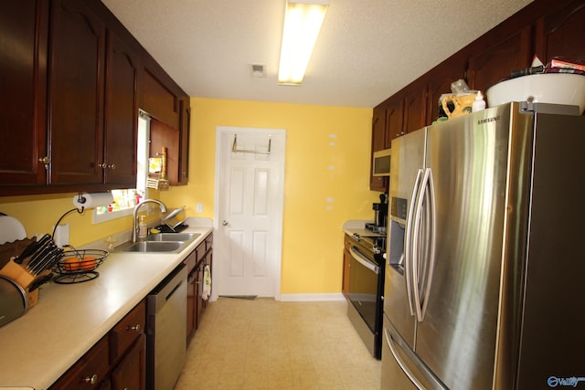 207 Brook Wind Dr, Hazel Green, AL 35750 - kitchen featuring a sink, appliances with stainless steel finishes, visible vents, light countertops, and light floors