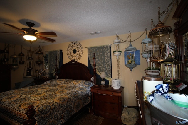 207 Brook Wind Dr, Hazel Green, AL 35750 - bedroom with ceiling fan and a textured ceiling