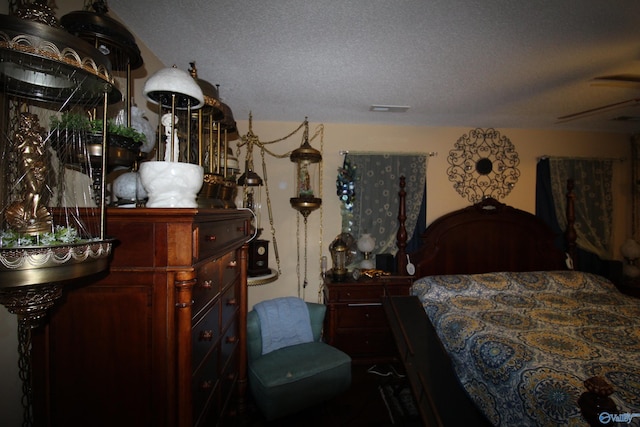 207 Brook Wind Dr, Hazel Green, AL 35750 - bedroom featuring a textured ceiling and visible vents