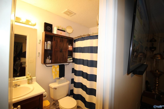 207 Brook Wind Dr, Hazel Green, AL 35750 - full bathroom with toilet, curtained shower, vanity, visible vents, and a textured ceiling