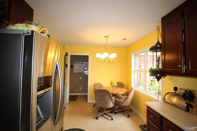 207 Brook Wind Dr, Hazel Green, AL 35750 - dining space with baseboards, light floors, and an inviting chandelier
