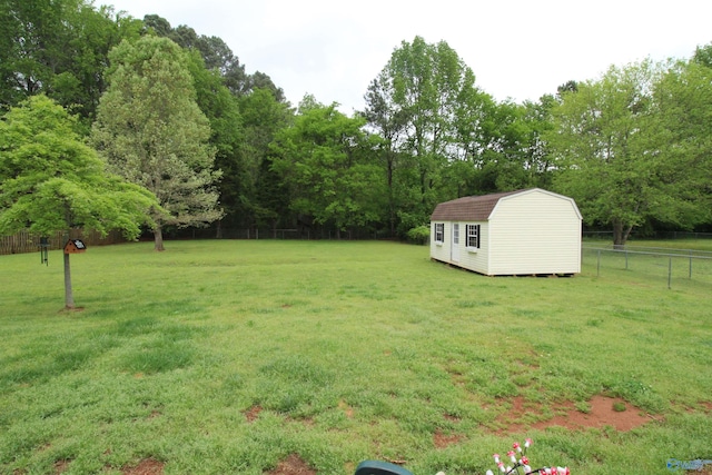 207 Brook Wind Dr, Hazel Green, AL 35750 - view of yard with an outdoor structure, a storage shed, and fence