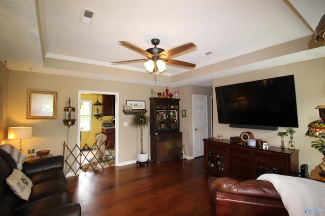 207 Brook Wind Dr, Hazel Green, AL 35750 - living area with wood finished floors, a ceiling fan, and a tray ceiling