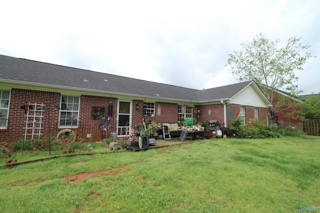 207 Brook Wind Dr, Hazel Green, AL 35750 - rear view of property with a lawn, fence, a patio, and brick siding