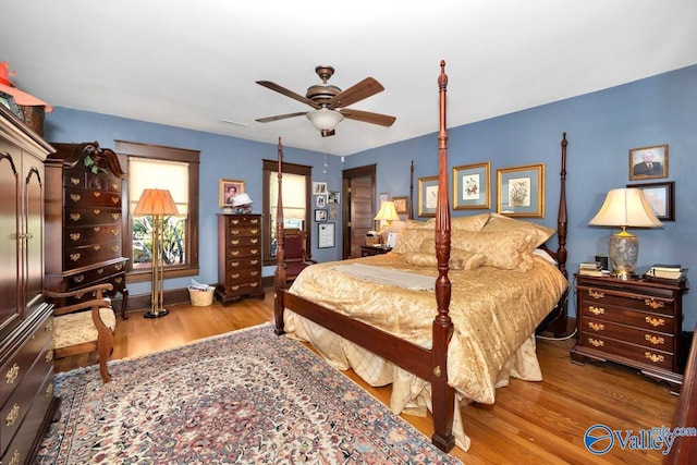 bedroom with hardwood / wood-style floors and ceiling fan