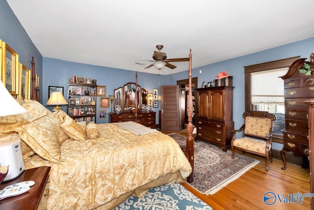bedroom featuring ceiling fan and hardwood / wood-style floors