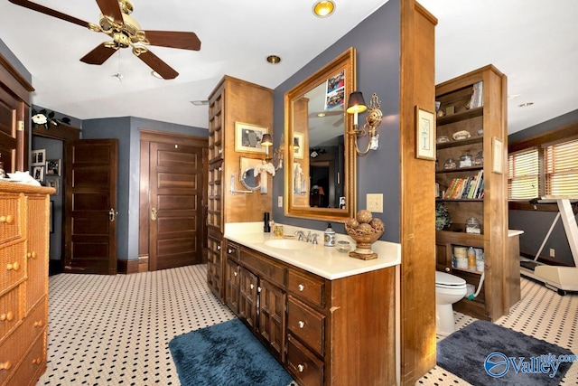 bathroom with ceiling fan, vanity, and toilet