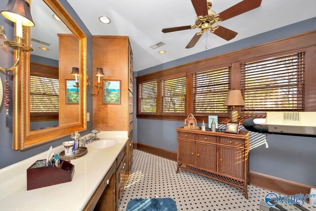 bathroom featuring vanity, a wealth of natural light, and ceiling fan
