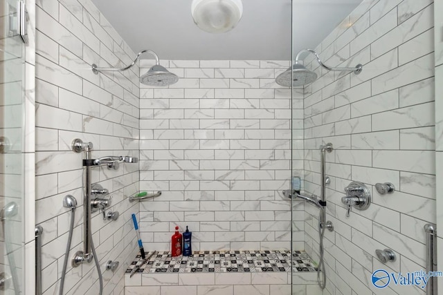 bathroom with a tile shower