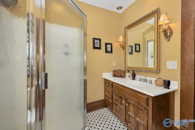 bathroom featuring vanity, tile patterned flooring, and a shower with door