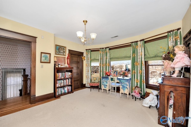 interior space featuring carpet flooring and a notable chandelier