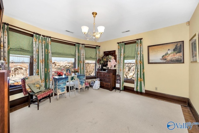 sitting room featuring an inviting chandelier