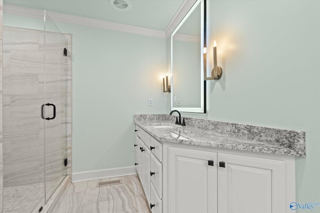 bathroom with crown molding, a shower with door, and vanity