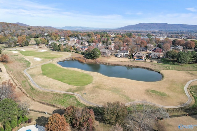 drone / aerial view featuring a water and mountain view