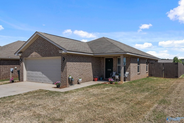 ranch-style house with a garage, a front yard, brick siding, and concrete driveway