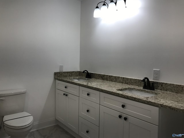 716 Ruby St, Gadsden, AL 35901 - bathroom featuring double vanity and marble look tile flooring