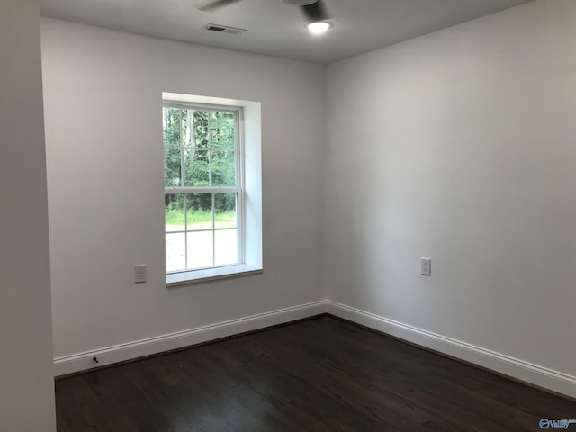 716 Ruby St, Gadsden, AL 35901 - empty room with dark wood-style flooring and baseboards