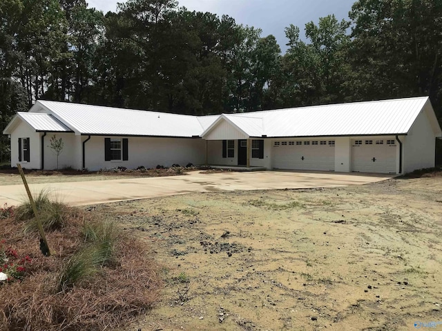 716 Ruby St, Gadsden, AL 35901 - ranch-style house with concrete driveway, a metal roof, and an attached garage
