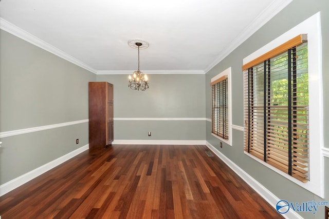 unfurnished room with baseboards, a chandelier, crown molding, and wood finished floors