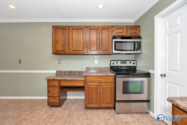 kitchen featuring stainless steel appliances, brown cabinets, baseboards, and ornamental molding