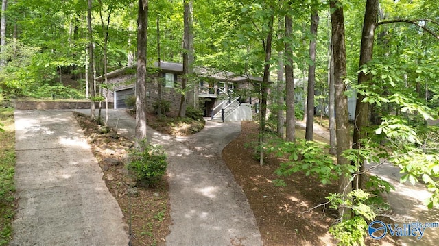 exterior space with a view of trees and stairs