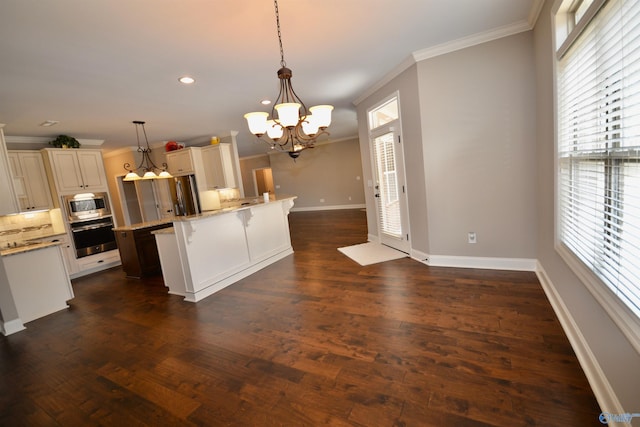 kitchen with tasteful backsplash, crown molding, dark wood-type flooring, a breakfast bar area, and appliances with stainless steel finishes