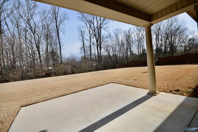 view of patio featuring fence