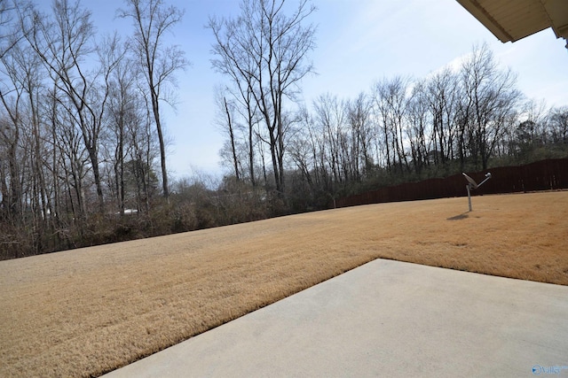 view of yard featuring a patio and fence