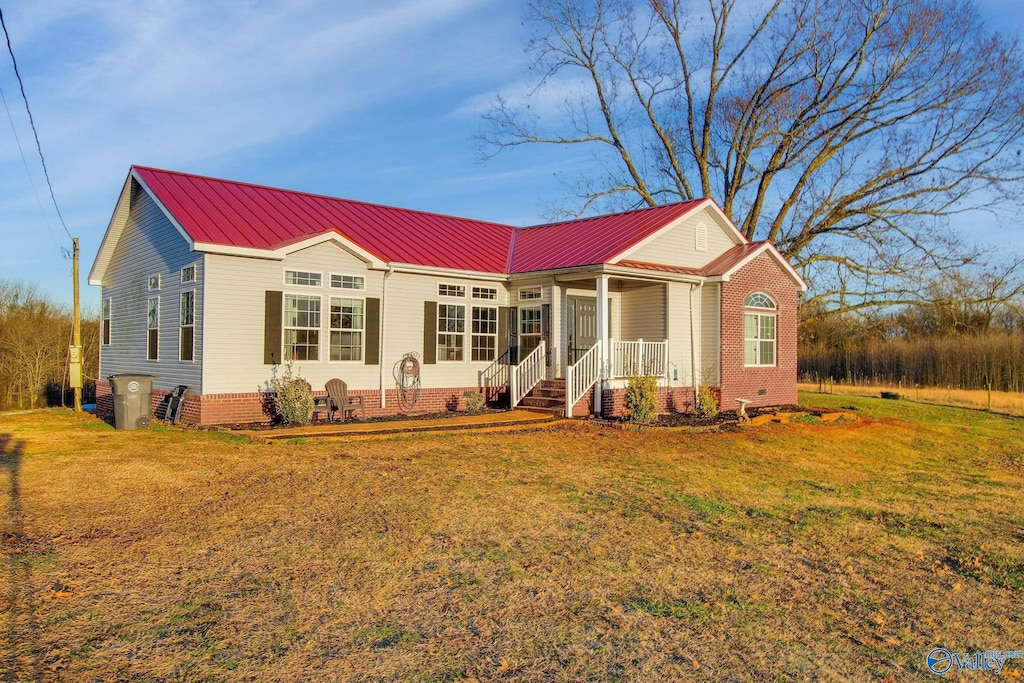 ranch-style home with a front lawn