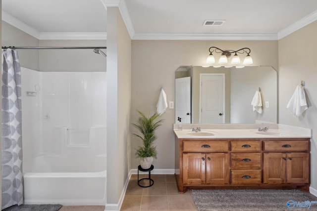 full bath featuring tile patterned flooring, crown molding, visible vents, and a sink
