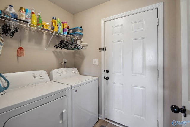 washroom featuring washer and dryer and laundry area