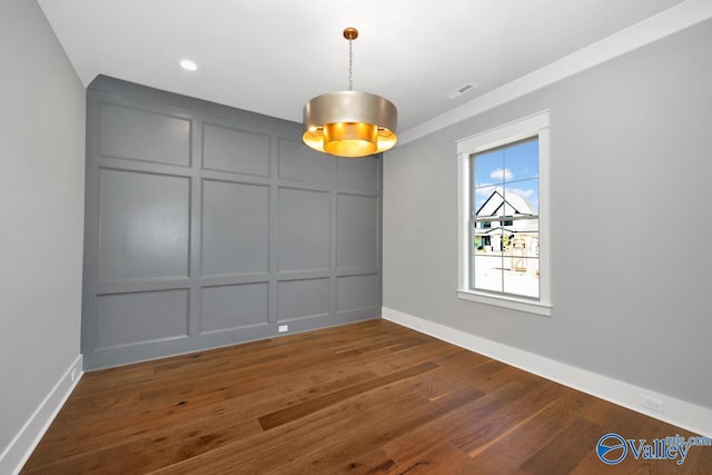 22938 Gunner Cir, Athens, AL 35613 - spare room with a decorative wall, wood finished floors, baseboards, and recessed lighting