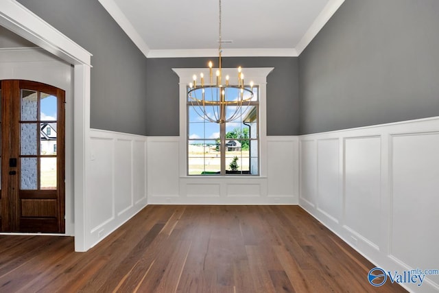 22938 Gunner Cir, Athens, AL 35613 - unfurnished dining area with a decorative wall, dark wood finished floors, a chandelier, a wainscoted wall, and crown molding