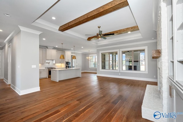 22938 Gunner Cir, Athens, AL 35613 - unfurnished living room with baseboards, ceiling fan, a tray ceiling, ornamental molding, and recessed lighting