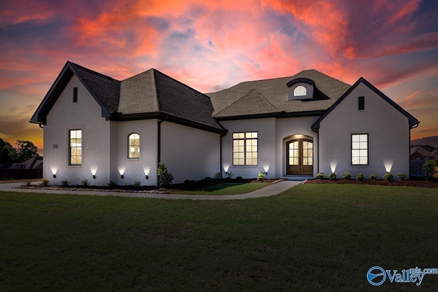 22938 Gunner Cir, Athens, AL 35613 - french provincial home with french doors, brick siding, a lawn, and roof with shingles