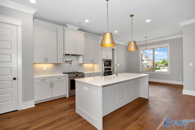22938 Gunner Cir, Athens, AL 35613 - kitchen with stainless steel appliances, tasteful backsplash, light countertops, ornamental molding, and white cabinetry