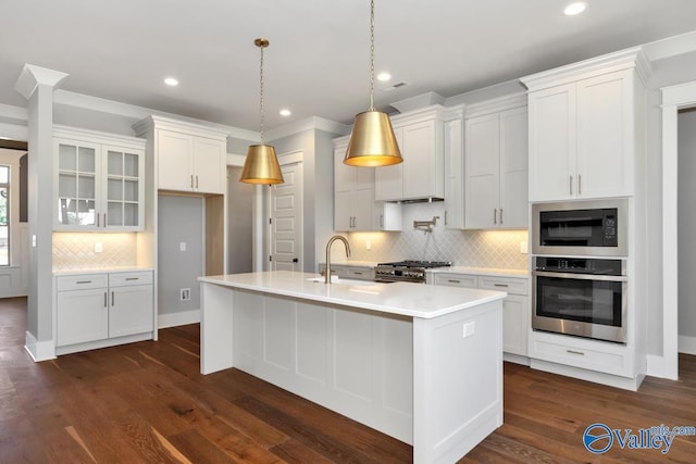 22938 Gunner Cir, Athens, AL 35613 - kitchen with appliances with stainless steel finishes, a sink, decorative backsplash, light countertops, and white cabinets