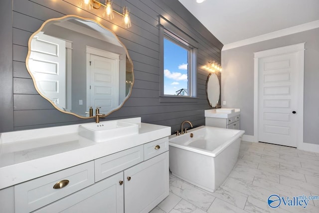 22938 Gunner Cir, Athens, AL 35613 - bathroom with wooden walls, marble finish flooring, two vanities, and a freestanding bath