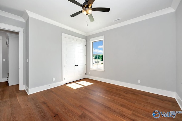 22938 Gunner Cir, Athens, AL 35613 - unfurnished bedroom with wood finished floors, baseboards, ornamental molding, and a ceiling fan