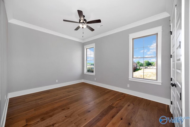 22938 Gunner Cir, Athens, AL 35613 - spare room with dark wood-style floors, a ceiling fan, baseboards, and ornamental molding