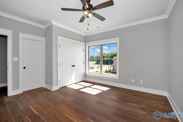 22938 Gunner Cir, Athens, AL 35613 - unfurnished bedroom with wood finished floors, ornamental molding, baseboards, and a ceiling fan